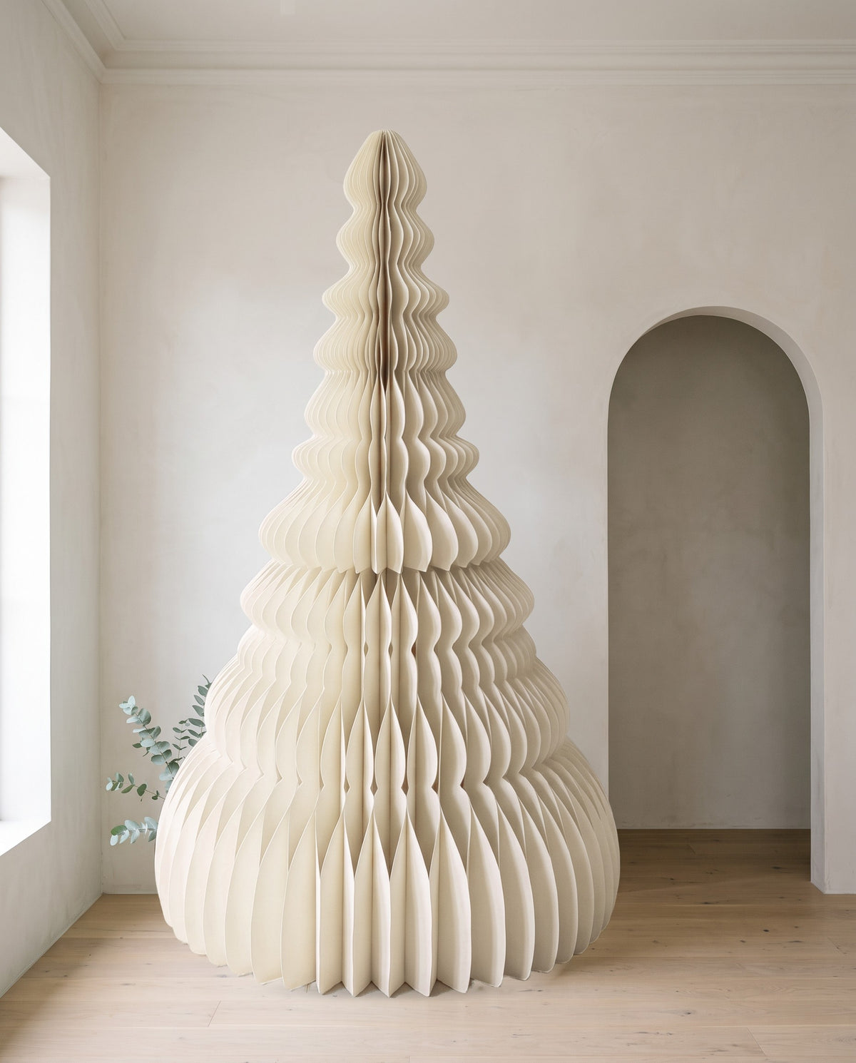 Élan paper Christmas tree, 240cm, in Off white, in a white room beside an arched doorway