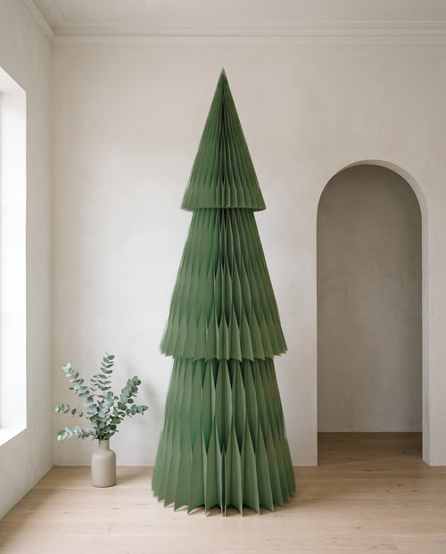 Forma paper Christmas tree, 240cm, in Sage, in a white room beside an arched doorway